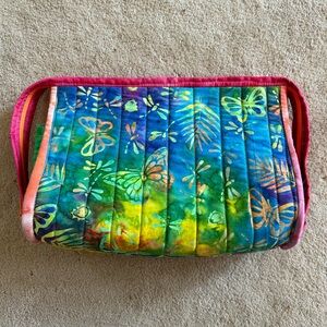 Travel essentials Batik zip around with 4 zip slots inside.  9.5” by 7”.